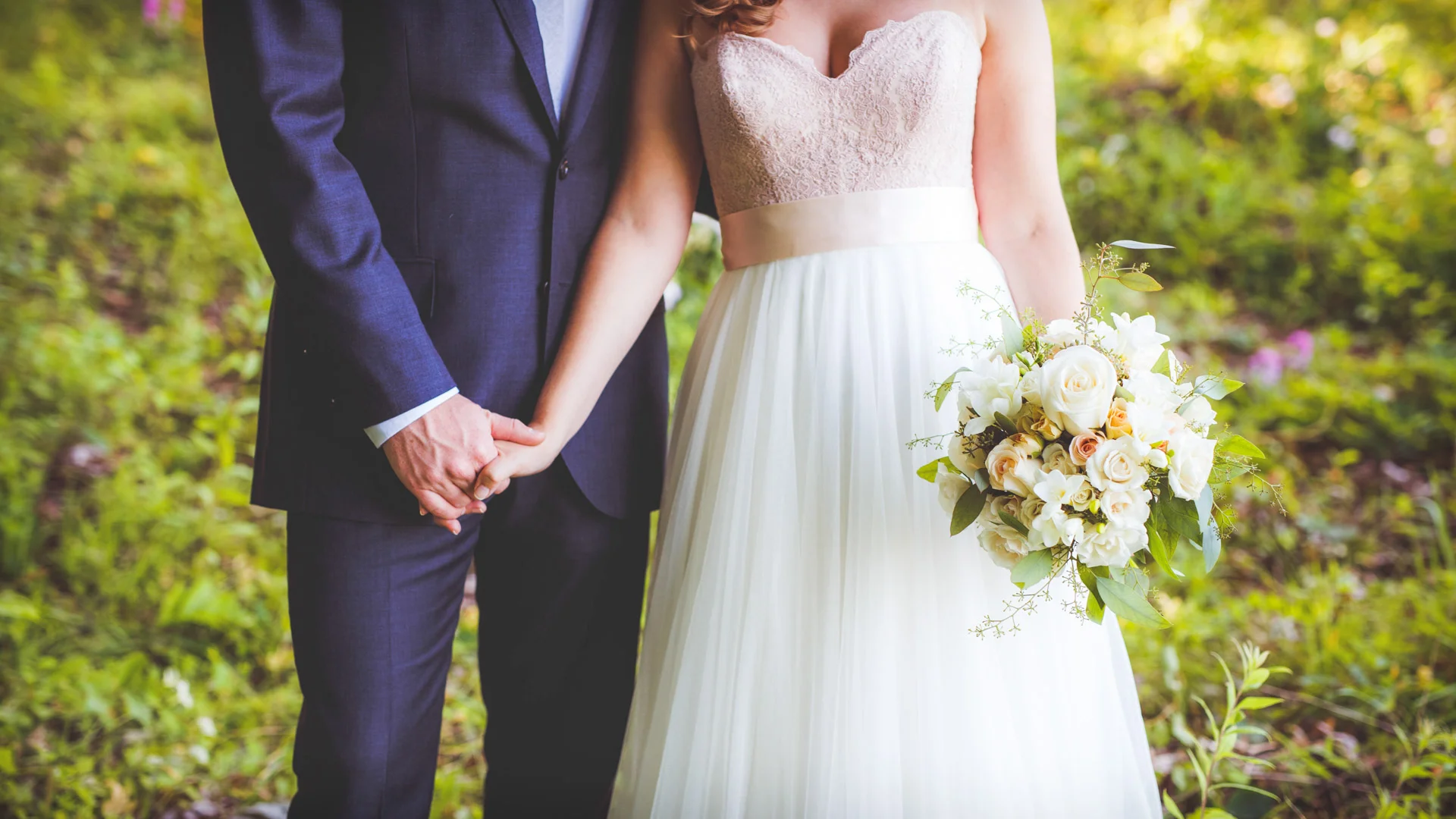 Bride-And-Groom-Holding-Hands.jpg